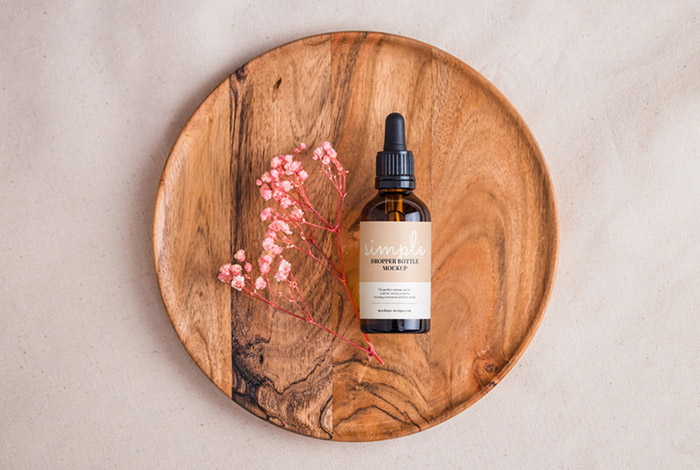 Amber bottle with dried flowers mockup