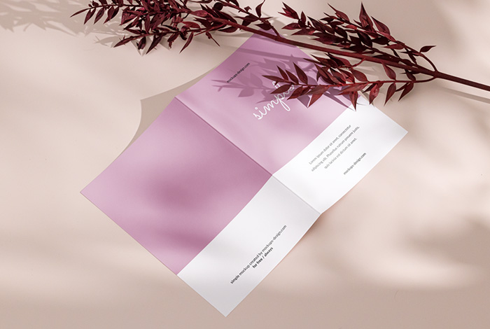 Bi fold flyer with dried leafs mockup