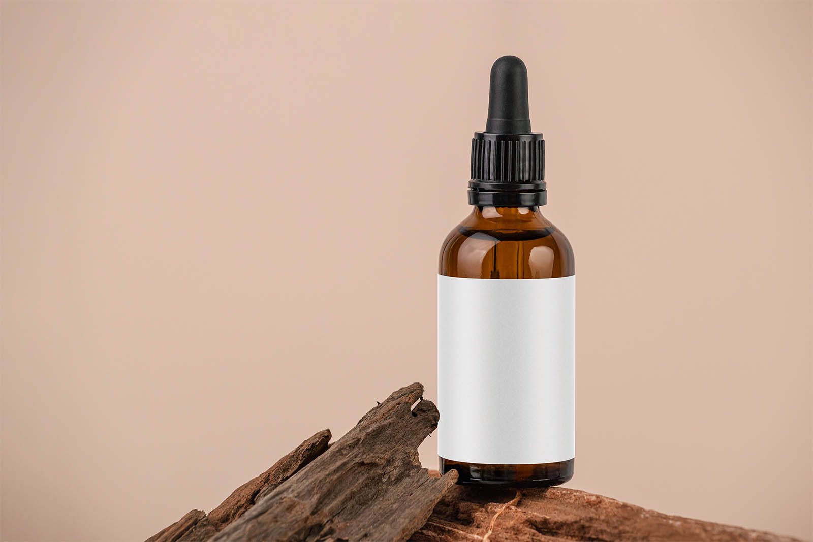 Amber dropper bottle on the rocks