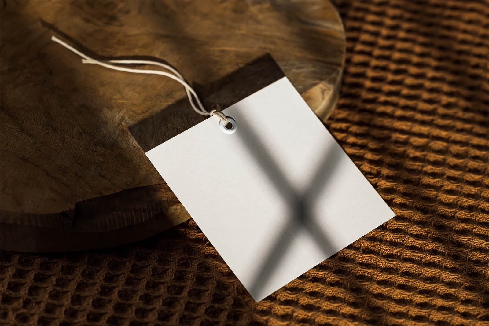 Square label tag on sliced wood mockup