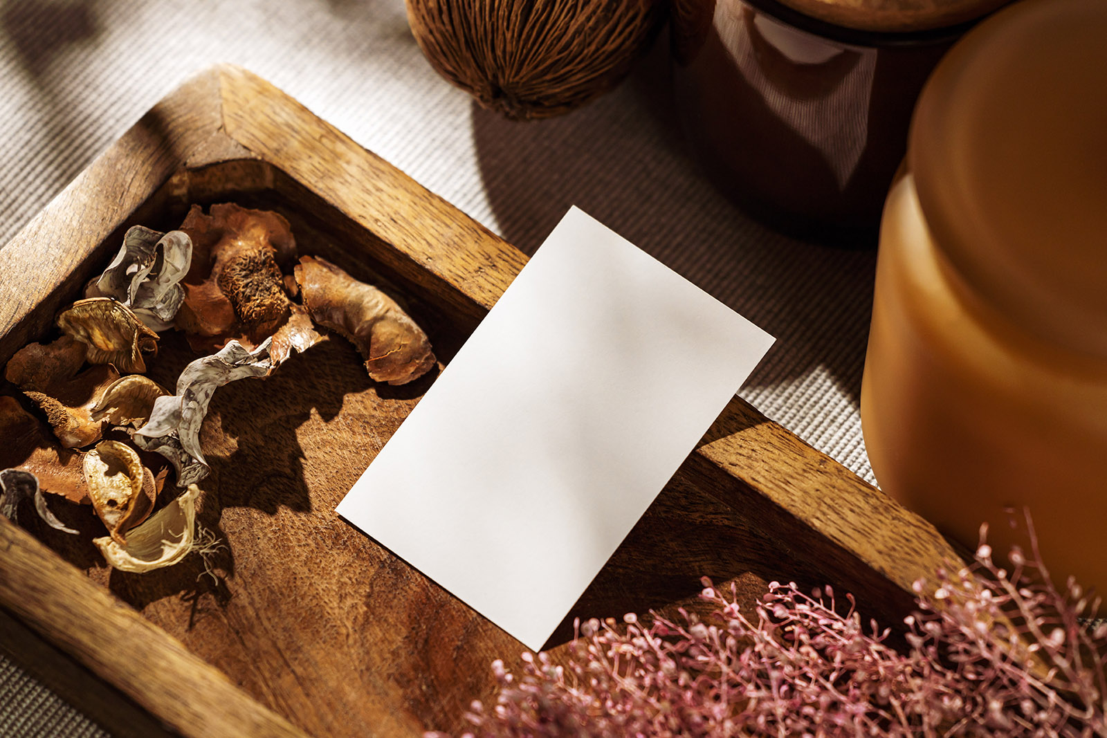 Business card on wooden tray PSD