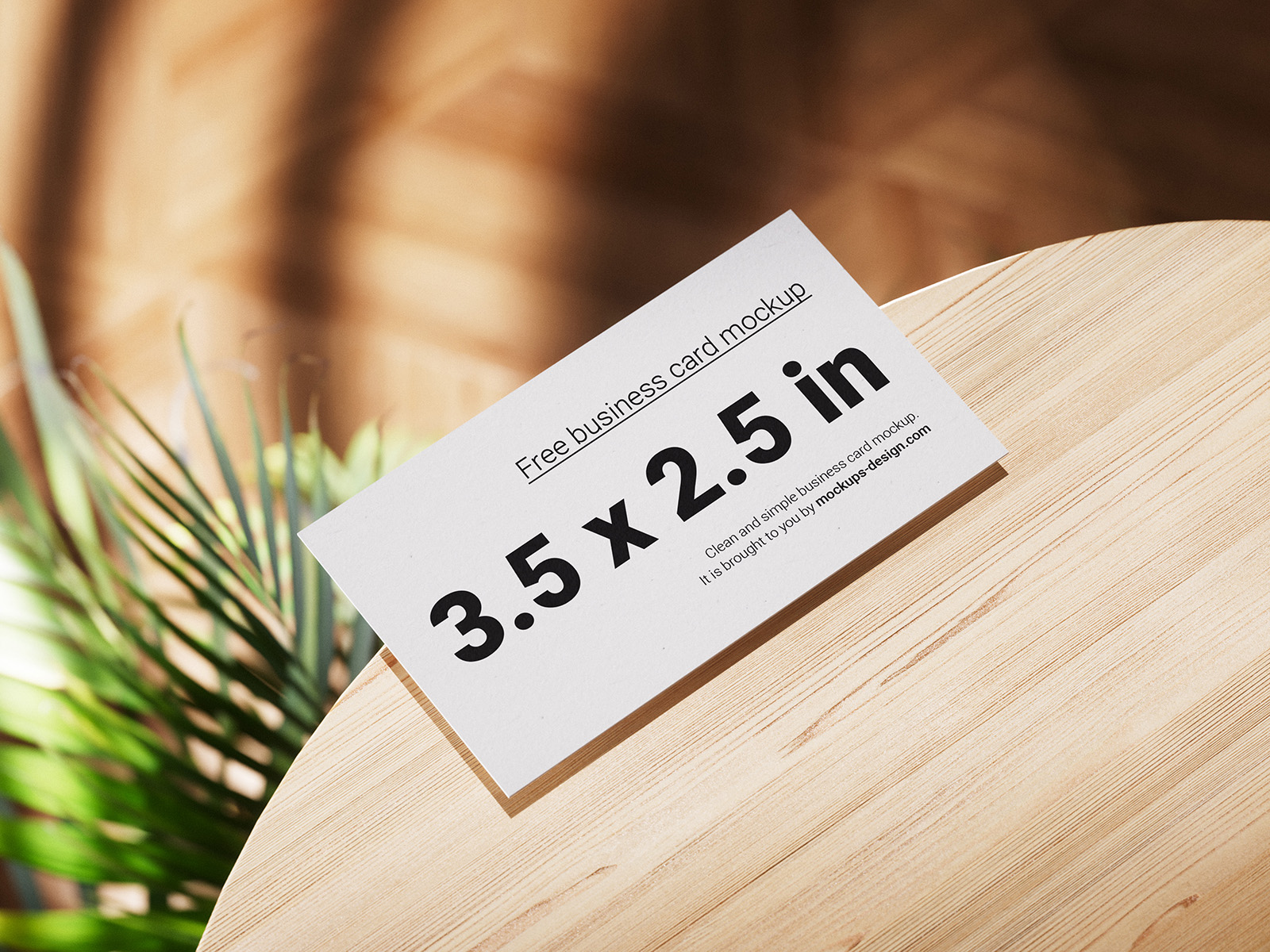 Business cards lying on a wooden table mockup