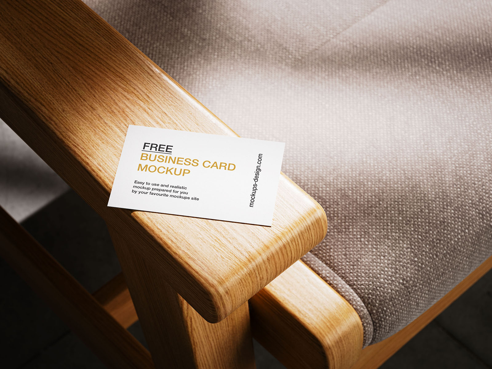Business card lying on armchair mockup