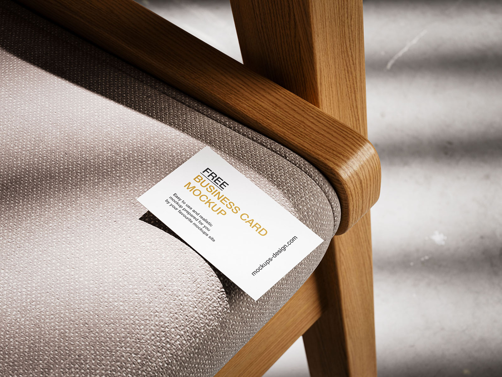 Business card lying on armchair mockup