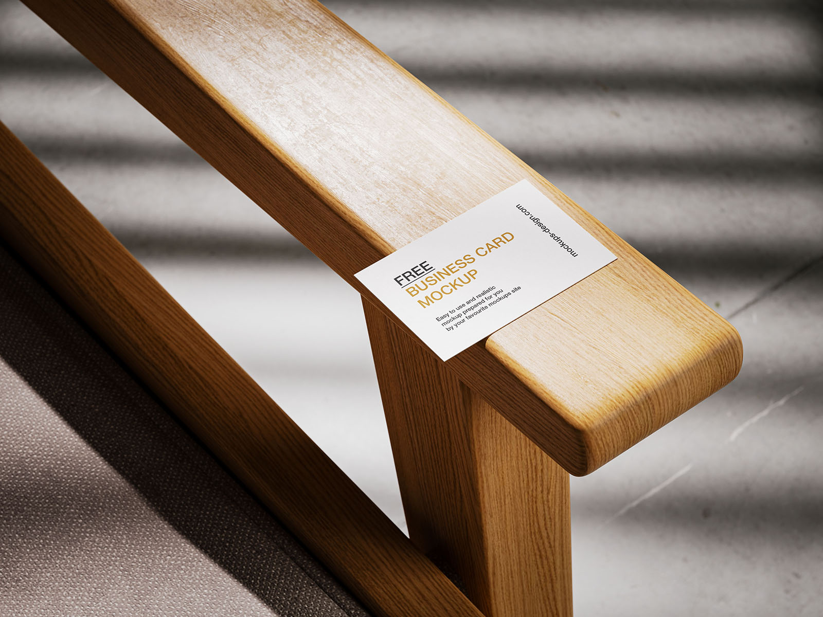 Business card lying on armchair mockup